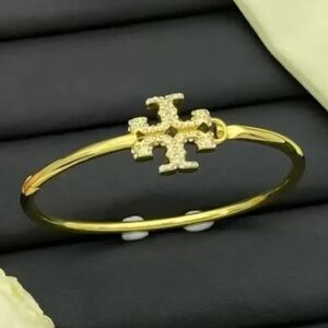 Tory Burch Gold Bangle with Crystal Emblem